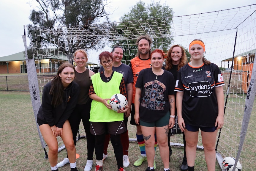 A womens soccer team and their coach.
