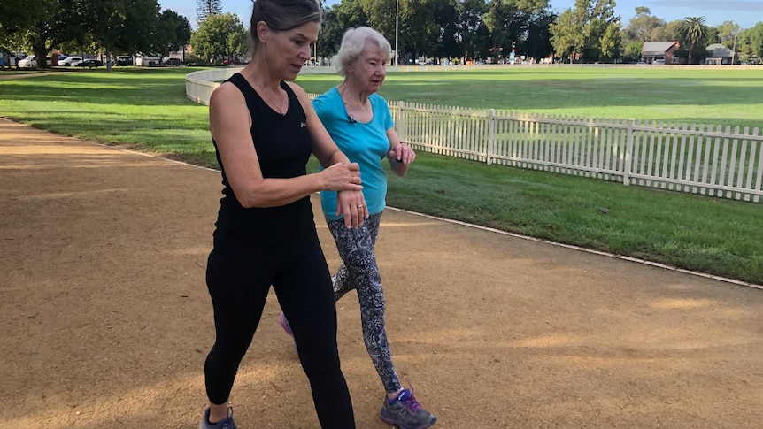 Liz de Vries and Heather Lee walking around a Sydney park.
