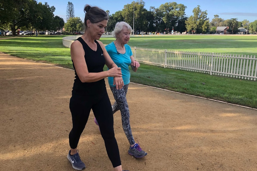 Liz de Vries and Heather Lee walking around a Sydney park.