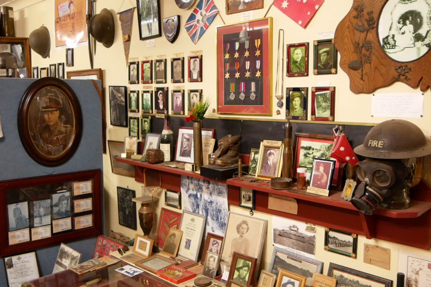 A museum featuring war photos, medals and other memorabilia