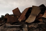 Twisted sheets of burnt metal are all that remain of a property at Bruthen South.