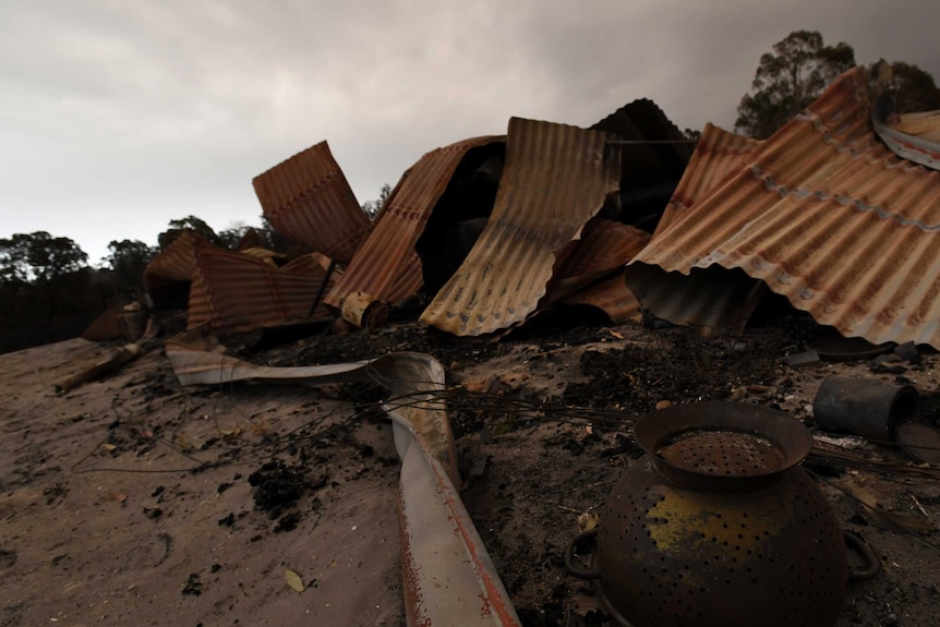 Twisted sheets of burnt metal are all that remain of a property at Bruthen South.