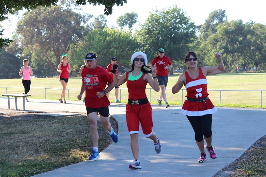 Runners in fancy dress wave