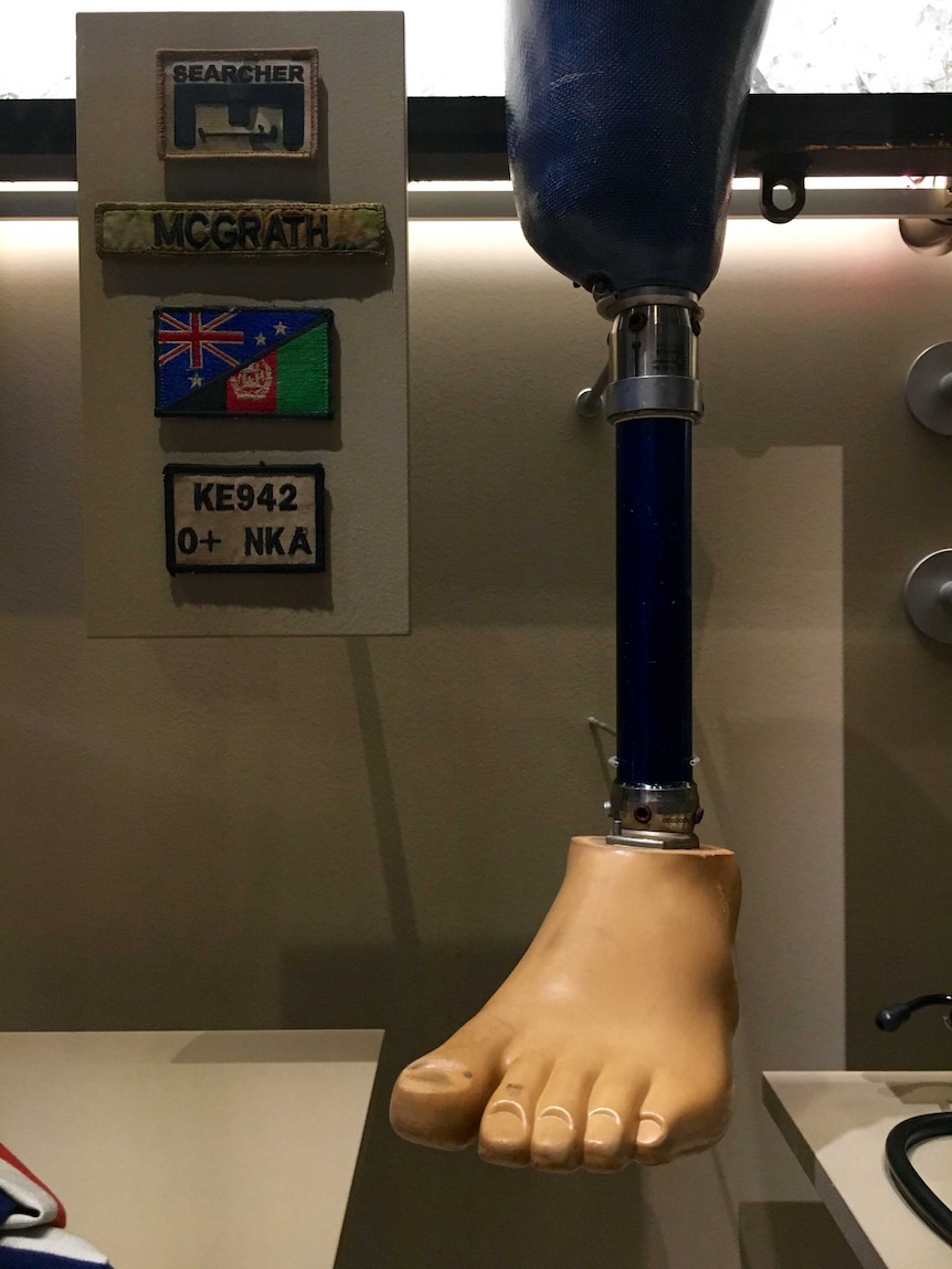 A prosthetic leg in  a display case.