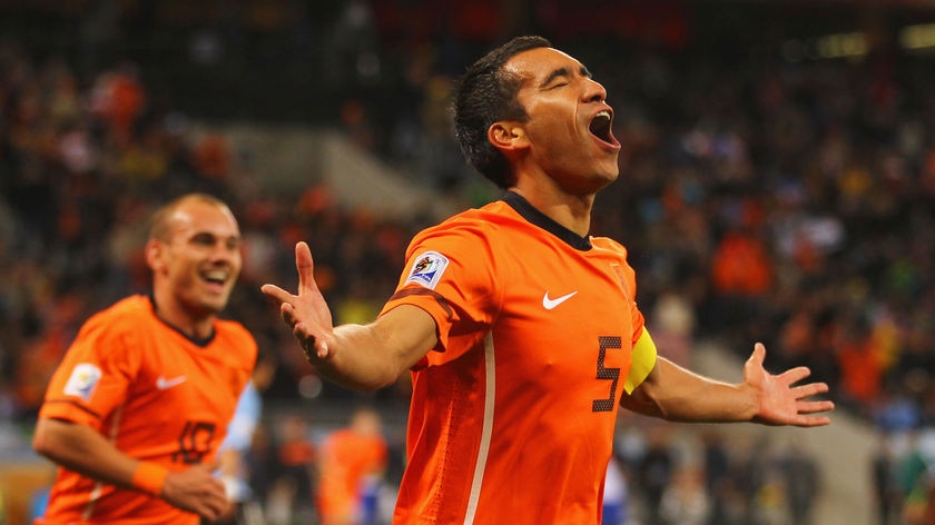 Giovanni Van Bronckhorst and Wesley Sneijder celebrate the opening goal against Uruguay.