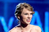 Taylor Swift accepts the Best Country Album award