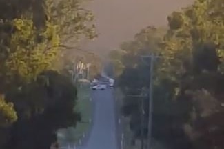 Police car blocks off a road in Seventeen Mile