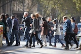 Pedestrians cross the street in  Melbourne's CBD June 2017