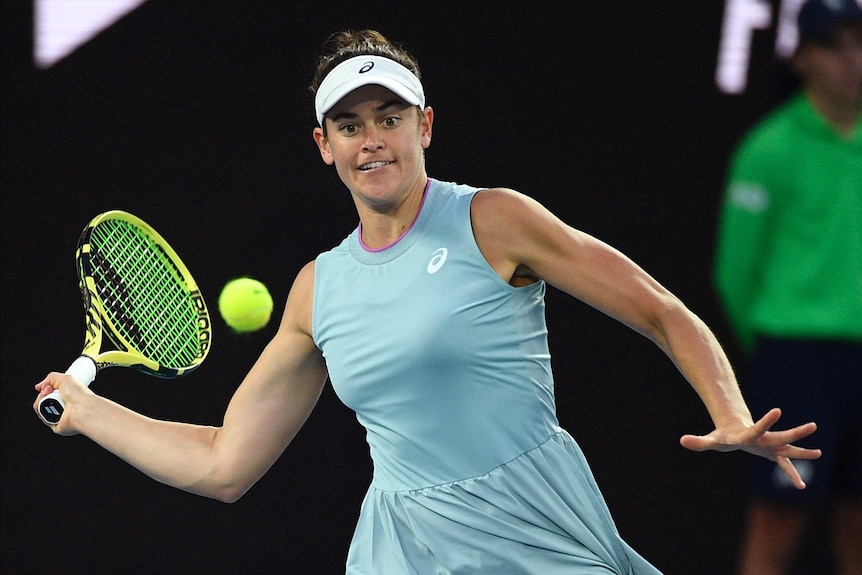 Jennifer brady plays a forehand return against Naomi Osaka.