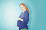 A pregnant woman cradles her belly.