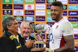 Gary Ella presents the Ella-Mobbs Cup to England captain Courtney Lawes.