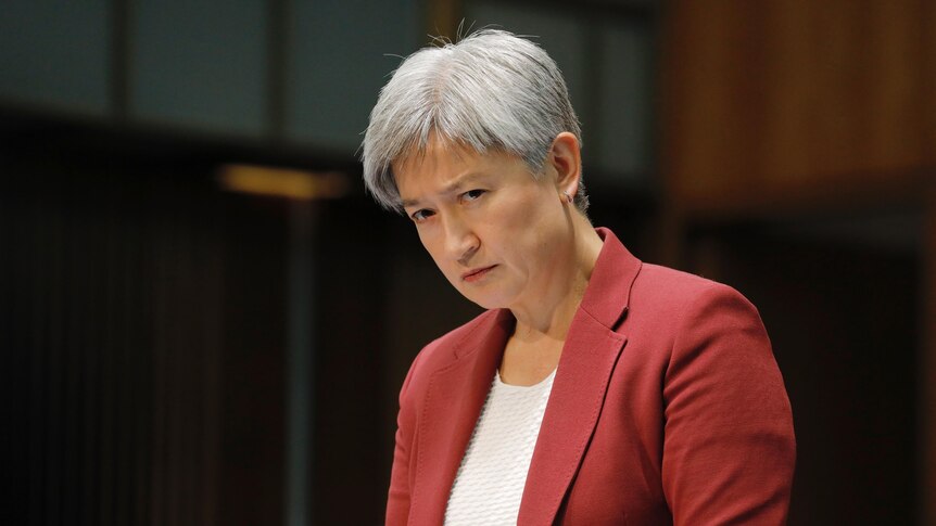  Penny Wong listens to a question looking serious.