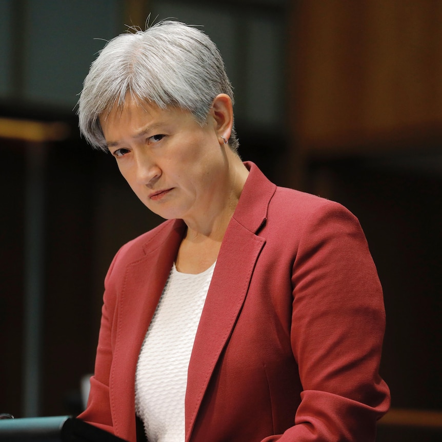  Penny Wong listens to a question looking serious.
