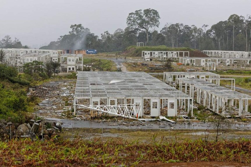 A series of workers lodgings in a jungle stripped completely bare.