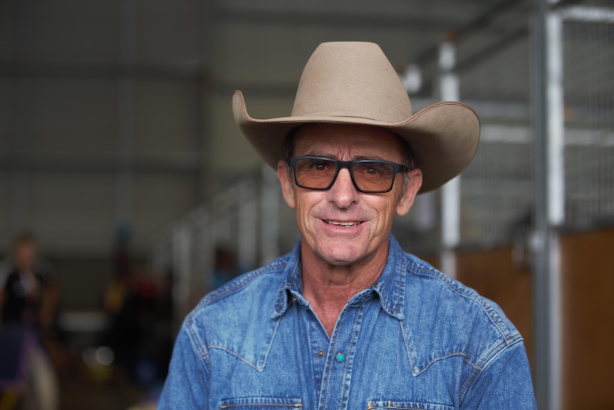 Photo of a man wearing a cowboy hat.