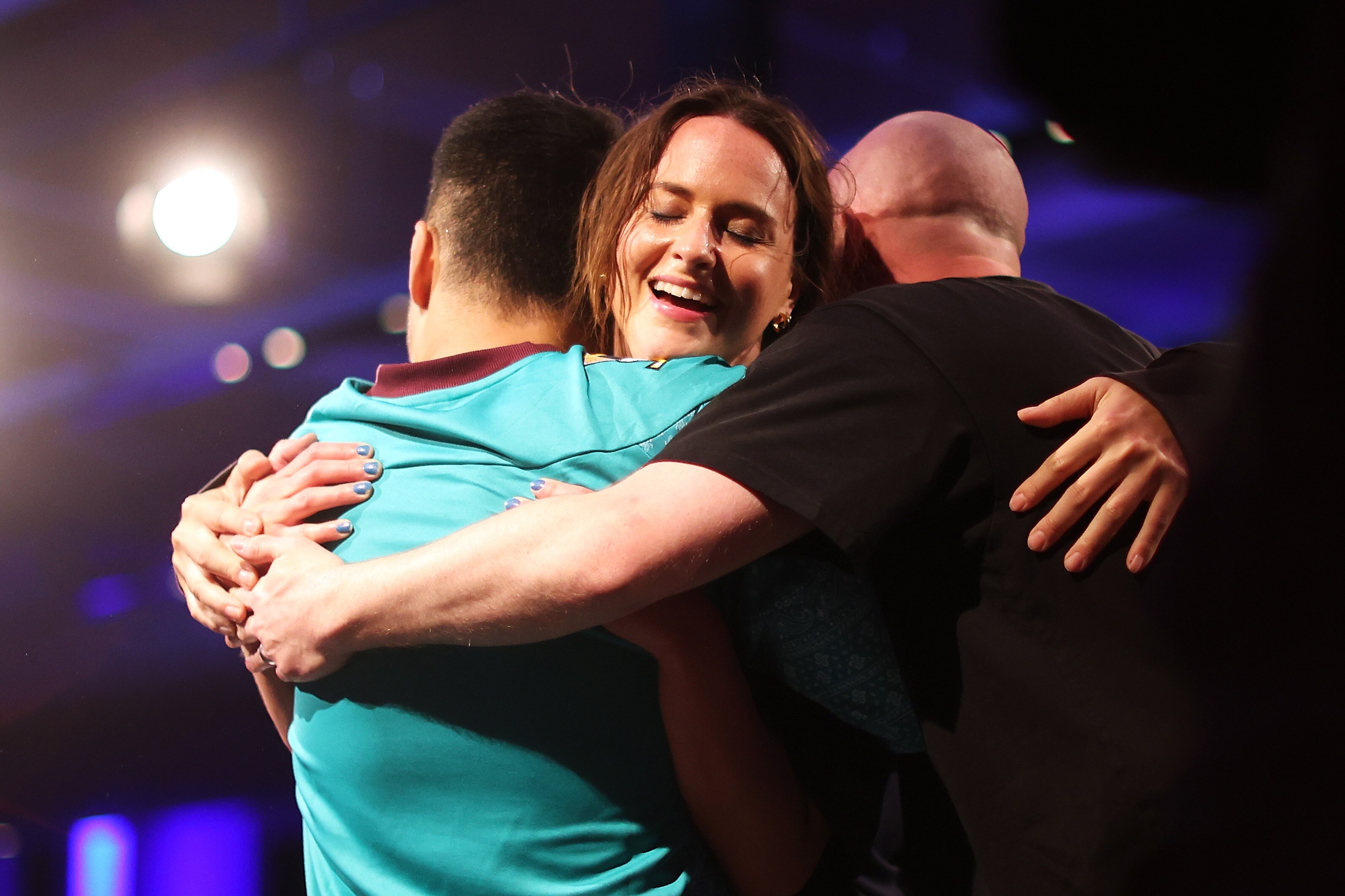 A woman celebrates after winning a breakdancing competition