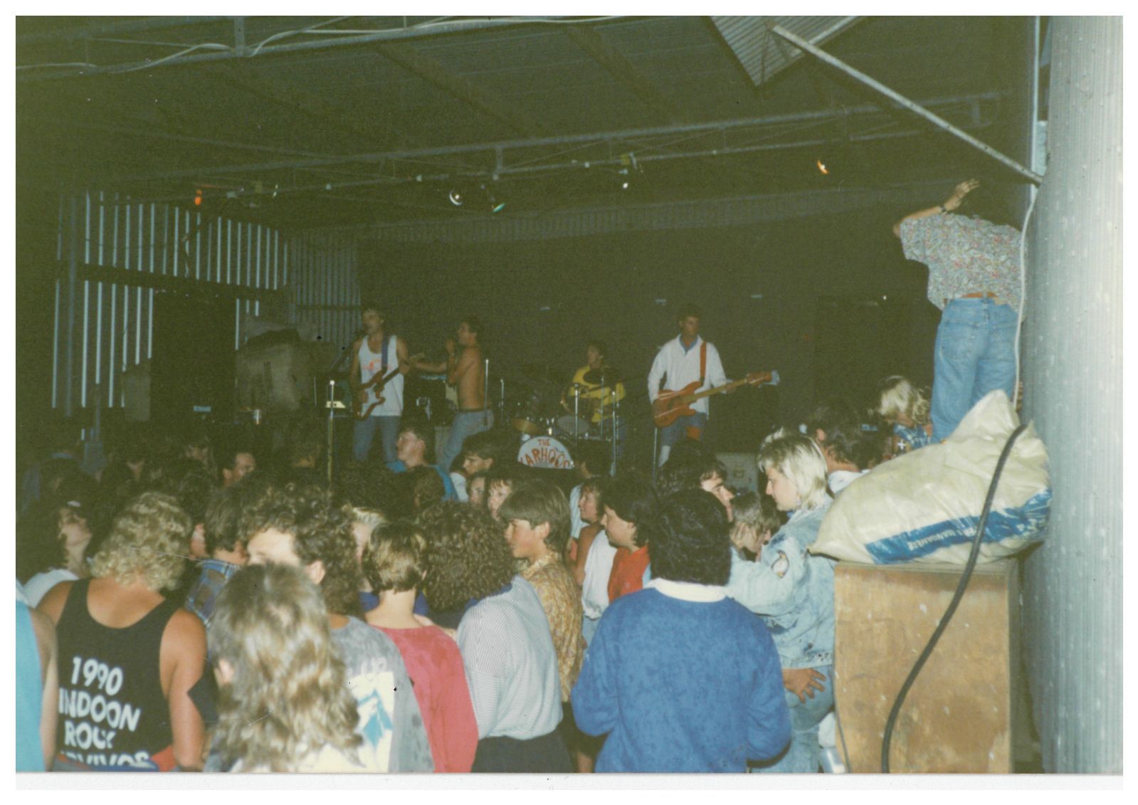 A band plays in a shearing shed.