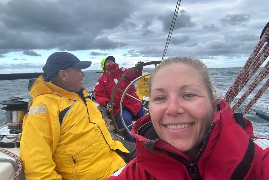 a woman taking a selfie on board the yacht celeste