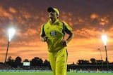 Australia's Pat Cummins reacts as the sun goes down at second ODI against New Zealand in Canberra.