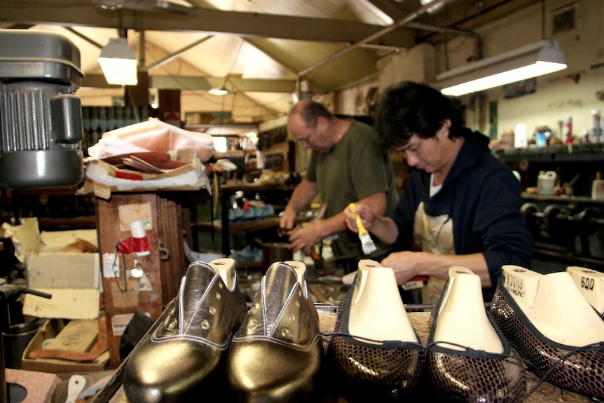 Workers in the Salvios shoe shop making shoes