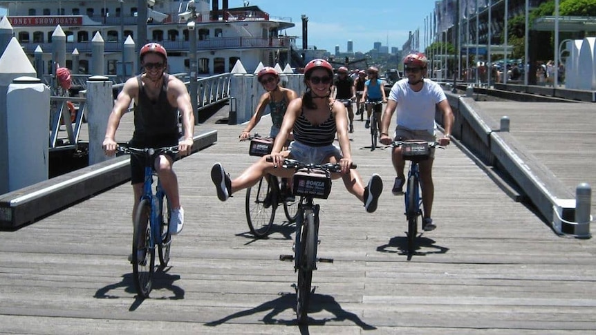 people on bikes smiling