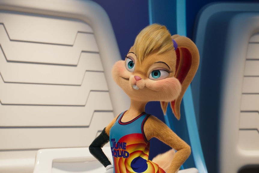 Lola Bunny, an animated rabbit in a basketball outfit with her ears pulled back as a ponytail, stands with her hands on her hips