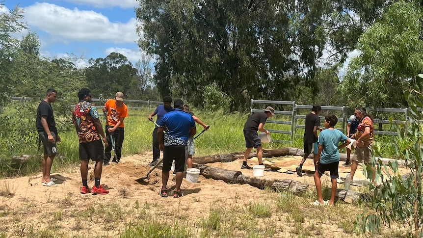 Indigenous students from Silver Lining Ficks Crossing tend to a veggie patch on their South Burnett property.
