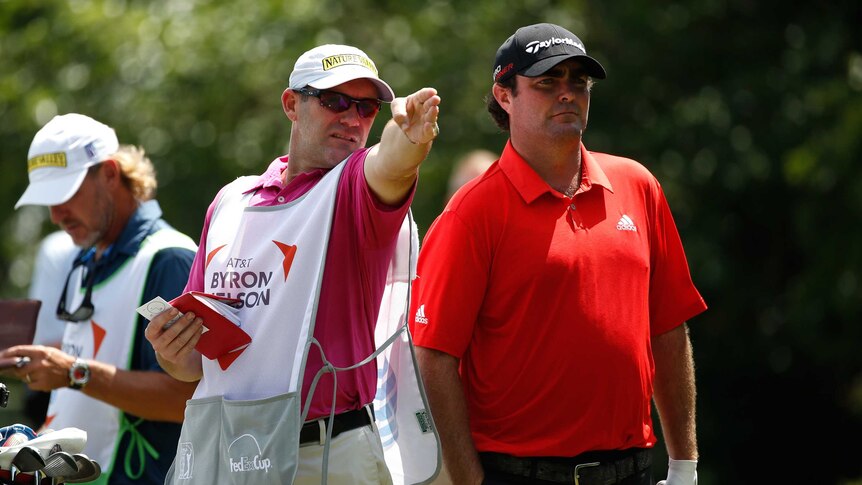 Steven Bowditch consults with his caddie