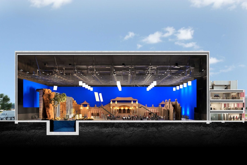 A digital image of a film set inside a large building.