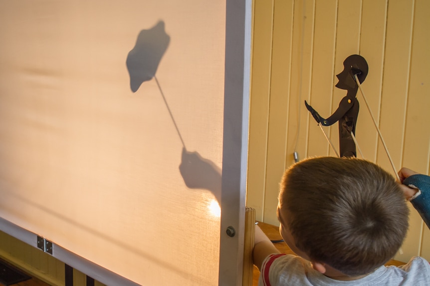 Smaller objects and templates were used to create shadows for the smaller puppeteers.