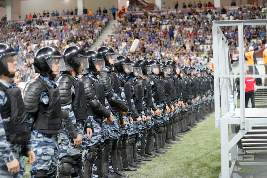 Officers line up across the field in Volgograd