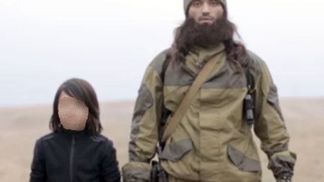 Video posted by Islamic State purports to show the execution of two "Russian spies" by a young boy.