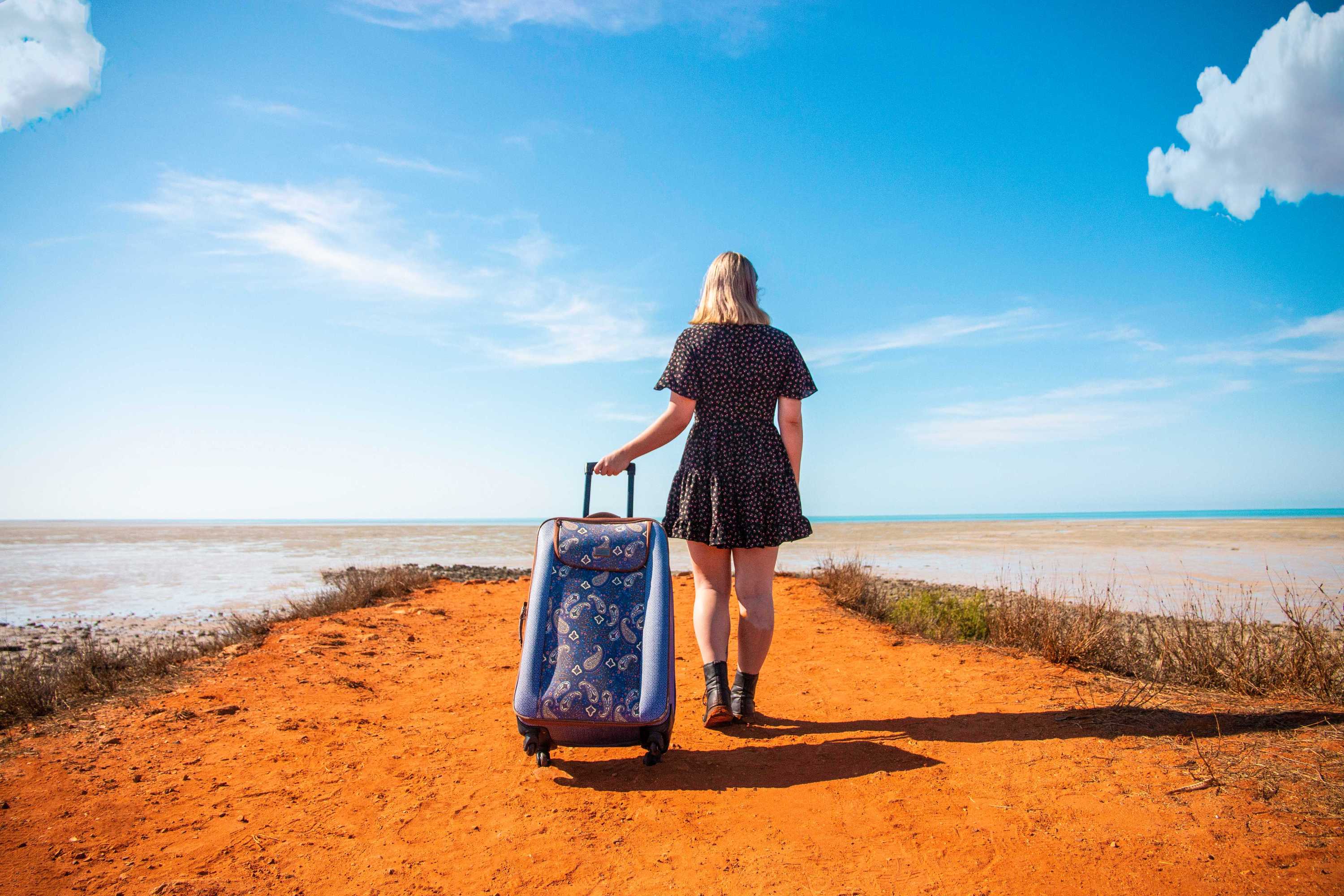girl walking with a suitcase.