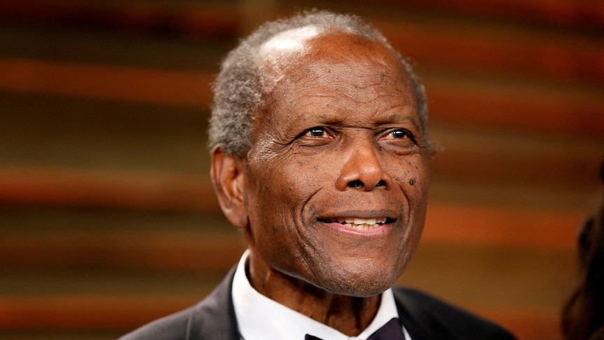 Close up of actor Sidney Poitier in a suit and tie.