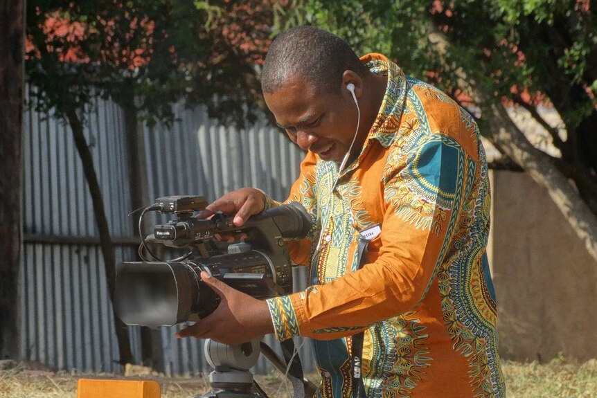 Africa producer/cameraman Dingani Masuku filming in Kenya.