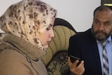 Karima Khald Sleiman el Saffar speaks to a translator in Iaq.