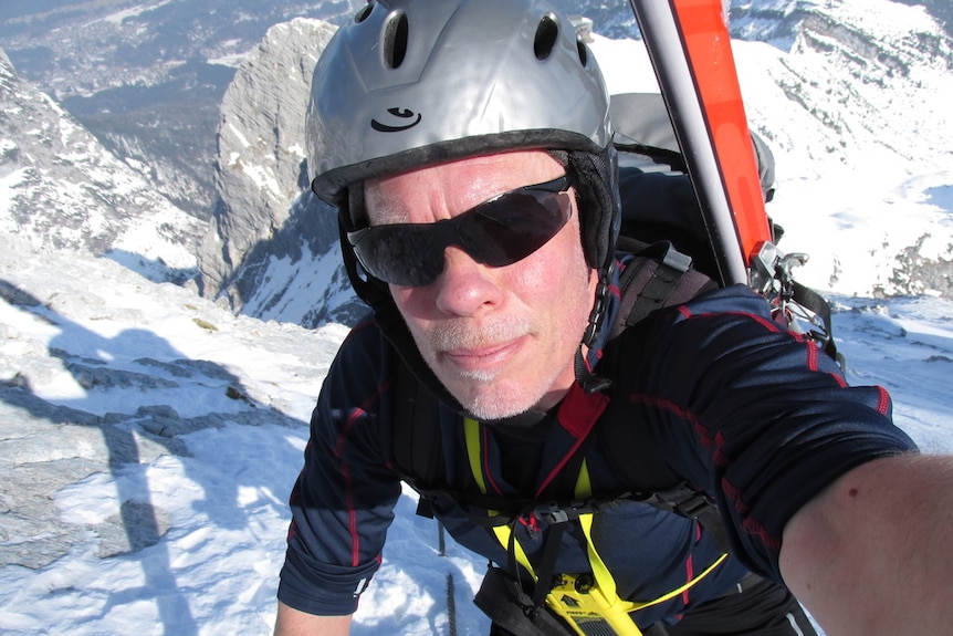 A selfie of alpinist Dr Hannes Vogelmann from a mountaintop