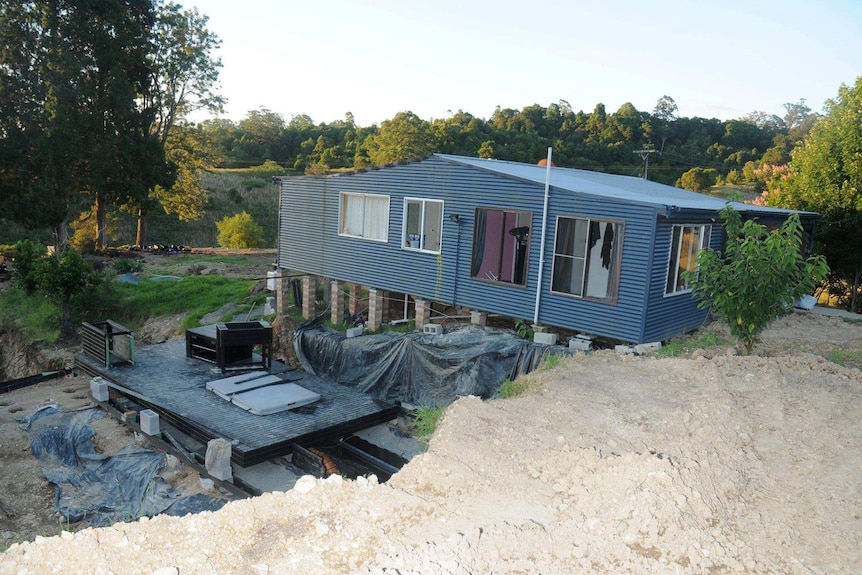 A concealed entrance to an alleged hydroponic set up is seen next to a rural property.