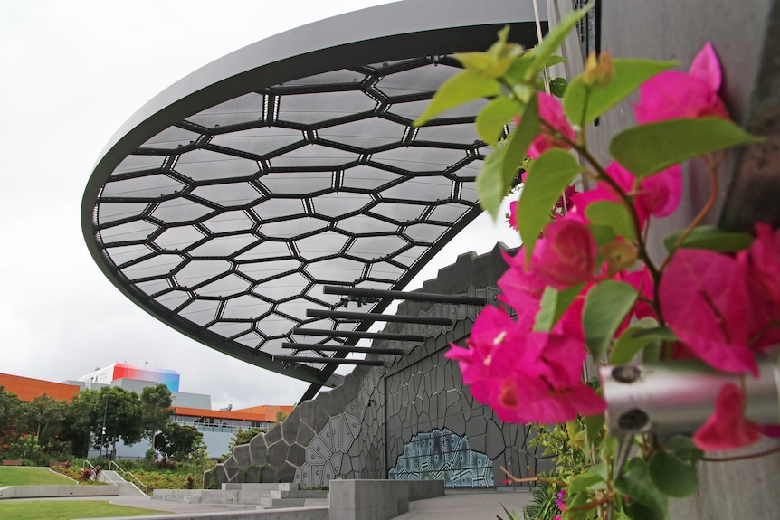 a stage with flowers in the foreground