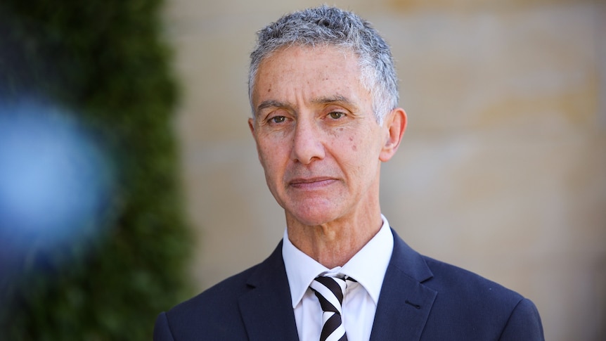 A head and shoulders shot of WA Racing and Gaming Minister Tony Buti speaking outside state parliament.