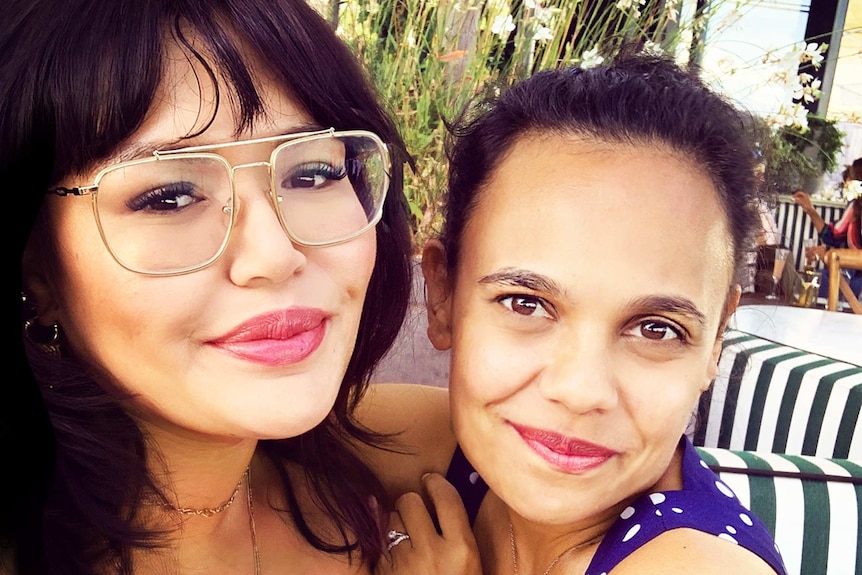 Nakkiah Lui (left) and Miranda Tapsell (right) posing for a photo while hugging each other