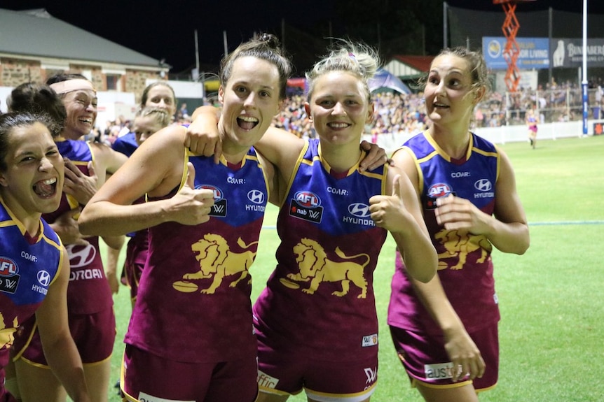 Brisbane Lions Womens players celebrate win over Adelaide