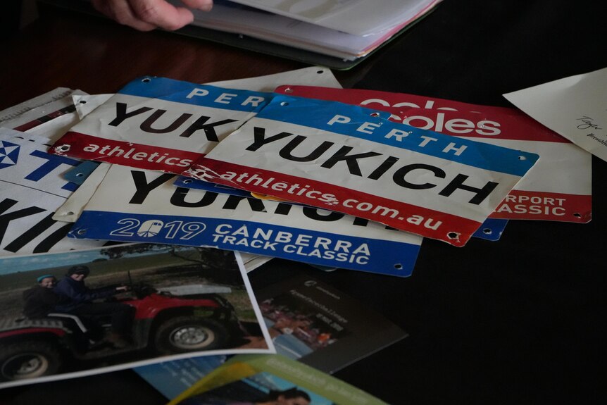 A series of racing bibs bearing the word 'Yukich'.