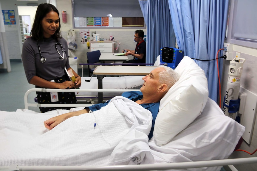 Aboriginal medical graduate Vinka Barunga with a patient.
