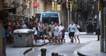 People flee from the historic Las Ramblas district of Barcelona.