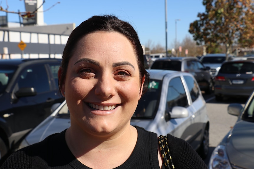 Headshot of a young smiling woman