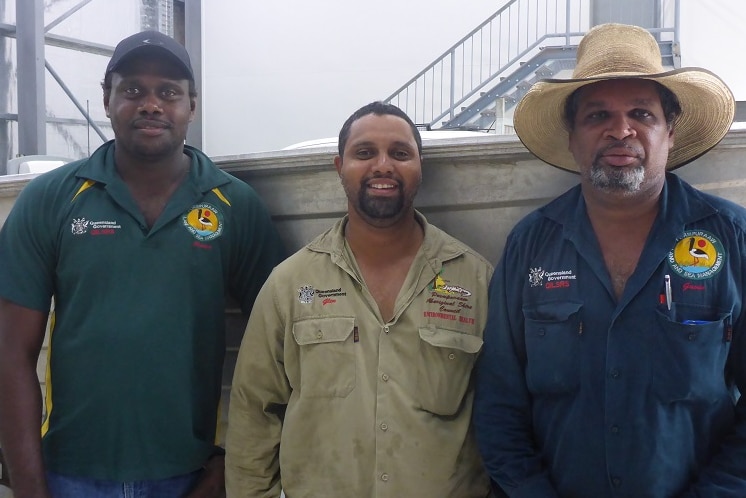 The three wear ranger uniforms and stand outside