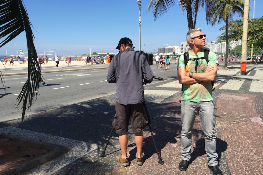 Ben Knight with cameraman Rob Hill at Copacabana Beach, Rio de Janeiro