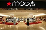 A woman walks into a Macys store in Denver