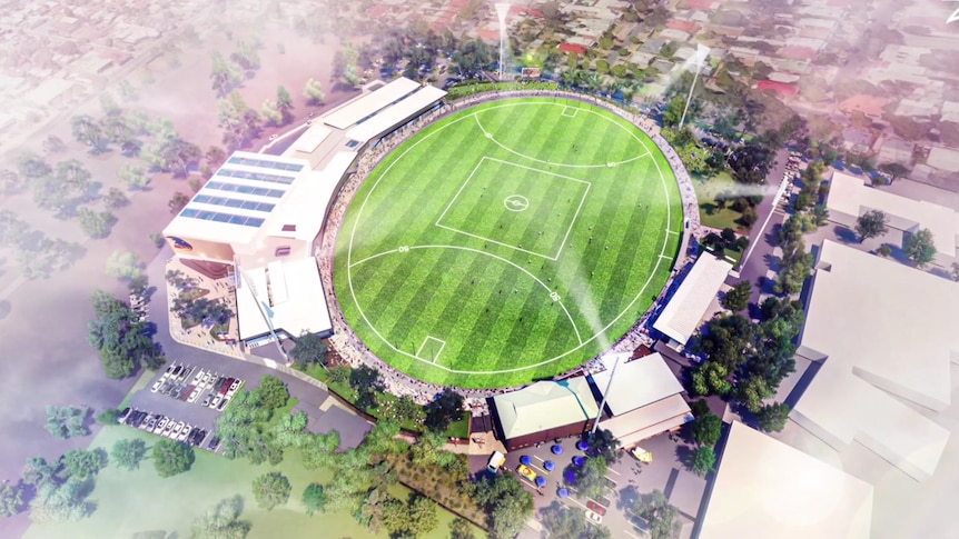 A birds-eye view of the a football oval with buildings around it 